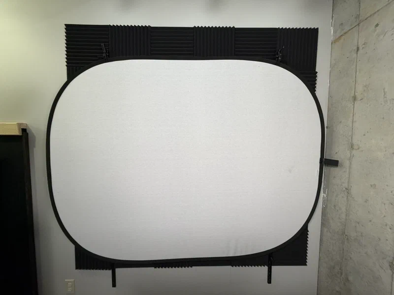 white screen mounted on shelving rails