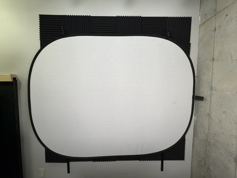 white screen mounted on shelving rails